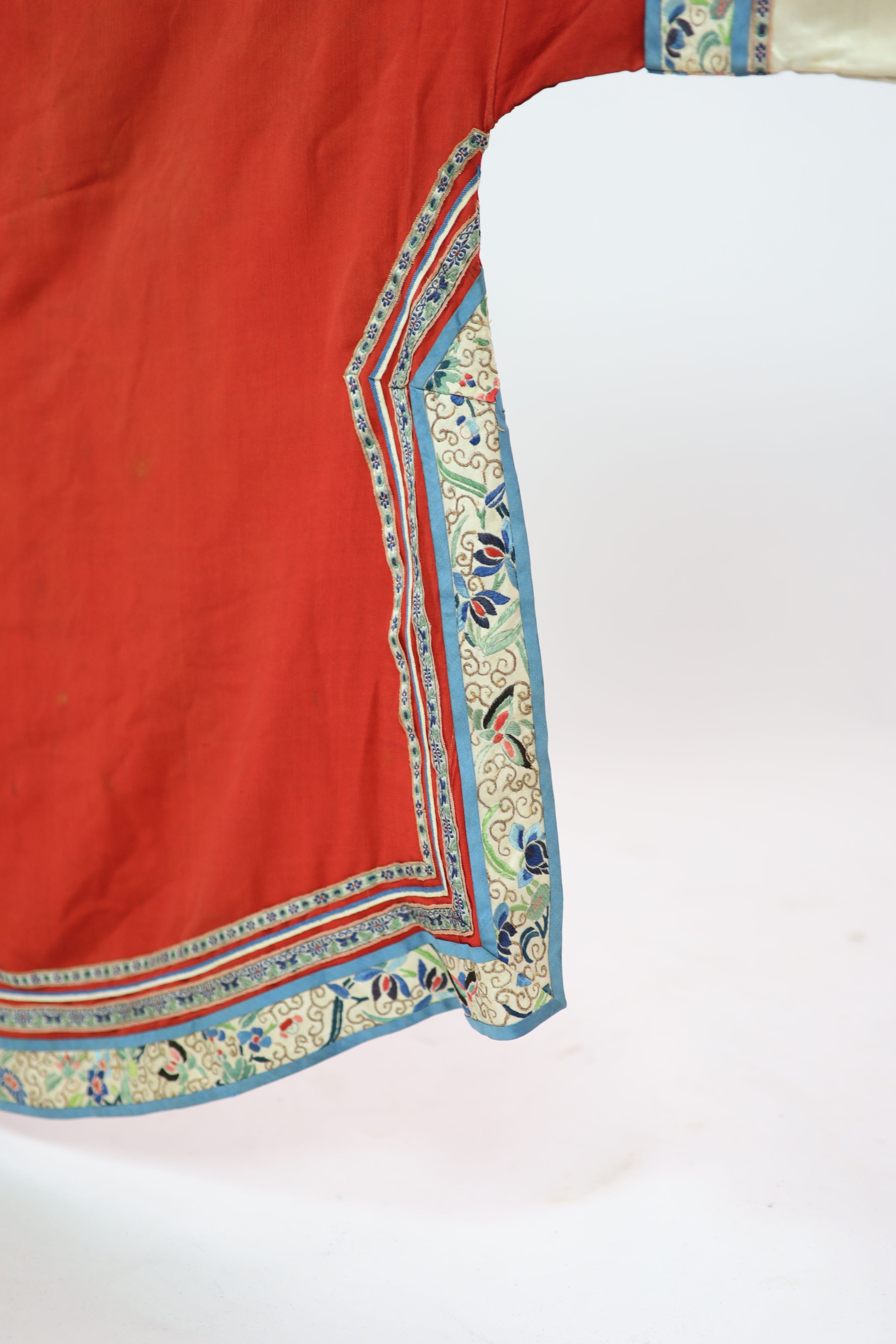 A Chinese red silk robe, late 19th century, 102cm drop